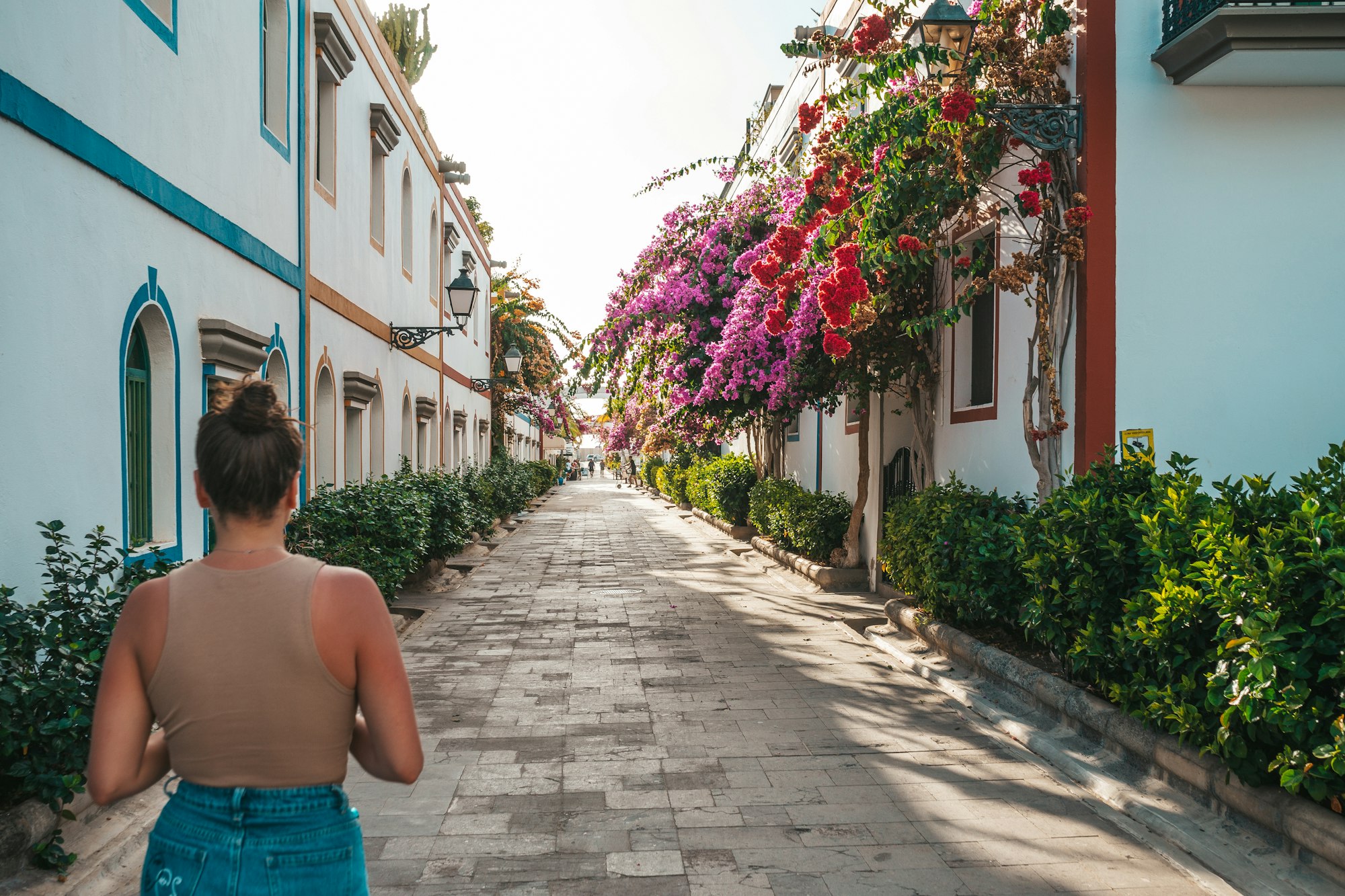 Young tourist walking by a pintoresque village in Gran Canaria